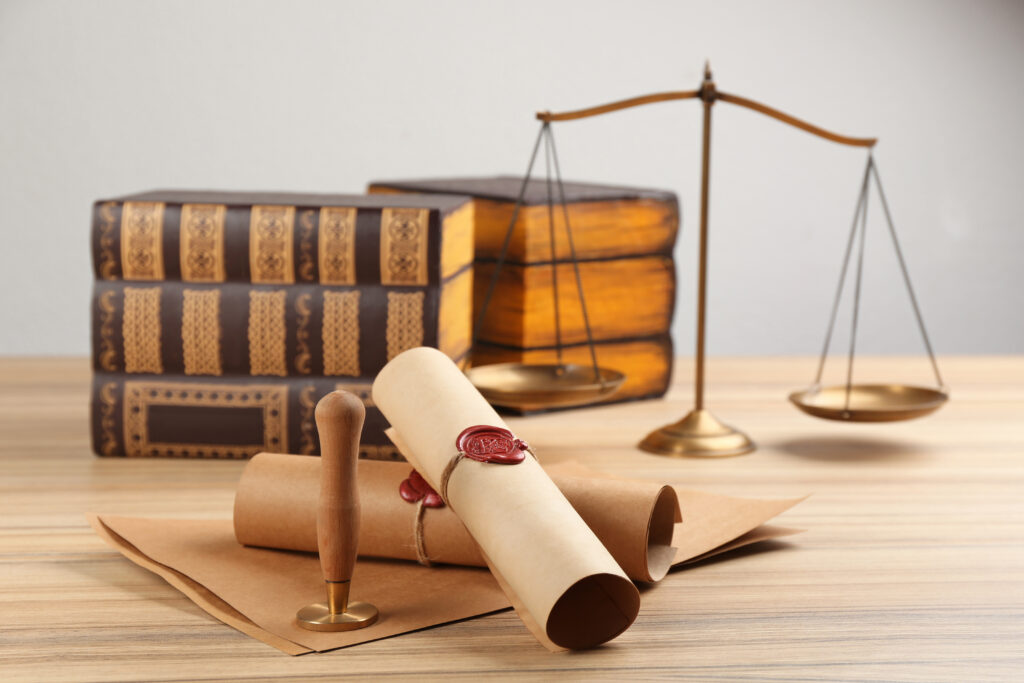 legal items - Notary's public pen and documents with wax stamp on wooden table