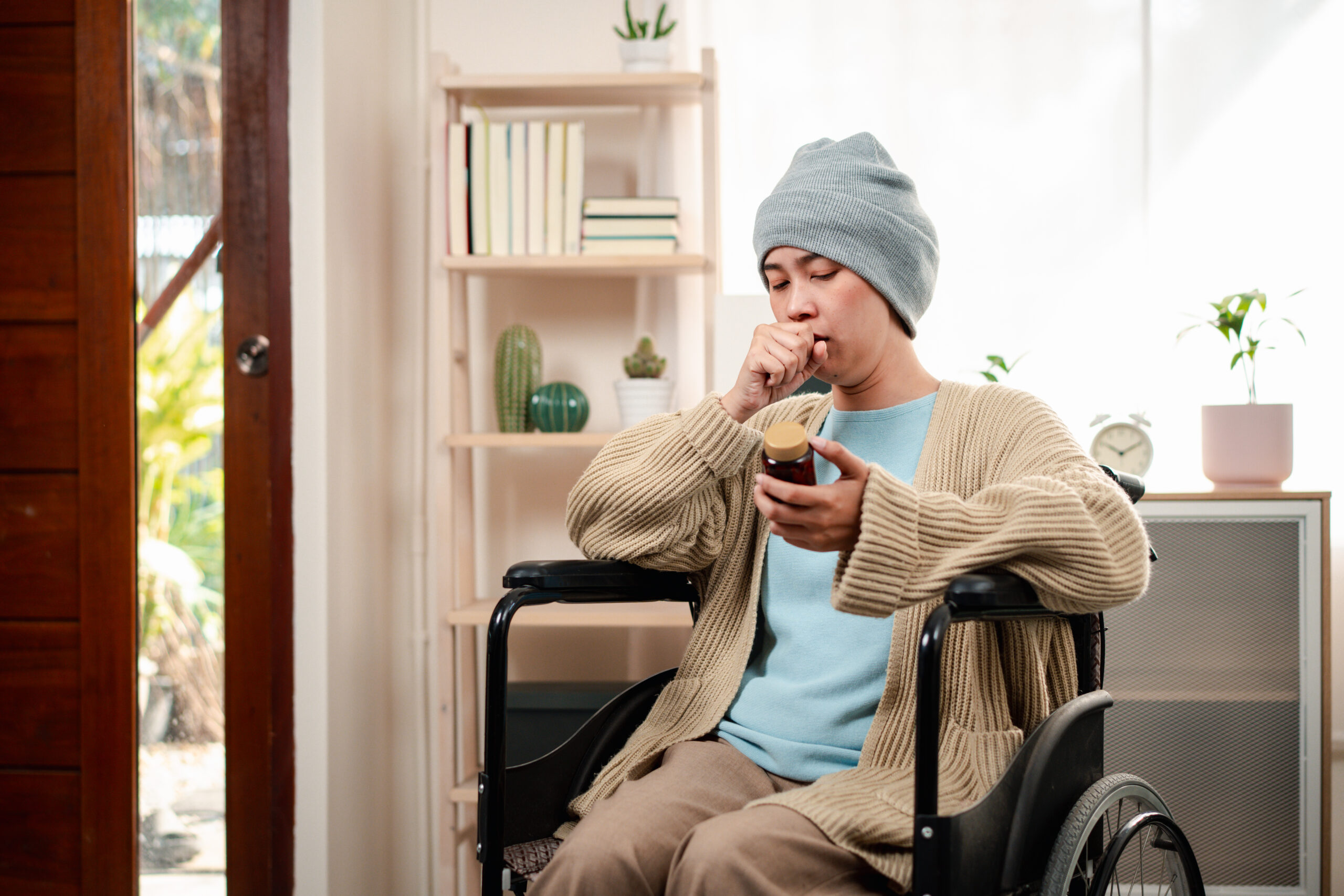 dysphagia support - mealtime management - Young woman have a sick with cancer her worry and stress feeling lifestyle in living room at home.